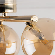 Estera multi-arm ceiling light made of glass, in a modern style