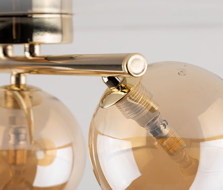 Estera multi-arm ceiling light made of glass, in a modern style